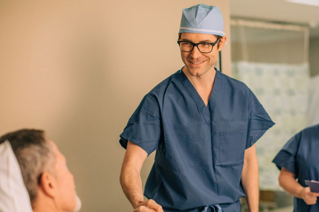 Center For Sight doctor meeting with a patient shaking hands.